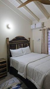 a bedroom with a large bed in a room at Your ideal home away from home. in The Rock