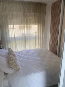 Katil atau katil-katil dalam bilik di Appartement T1 neuf