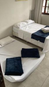 Ένα ή περισσότερα κρεβάτια σε δωμάτιο στο Apartamento a poucos metros do mar em Guarapari
