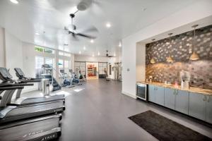 a large room with a kitchen with a counter at Luxury Stylish Apt in Historic Ybor City in Tampa