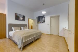Posteľ alebo postele v izbe v ubytovaní Deluxe suite in prime location