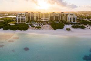 an aerial view of a resort with a large pool at The Ritz-Carlton, Aruba in Palm-Eagle Beach +144 photos