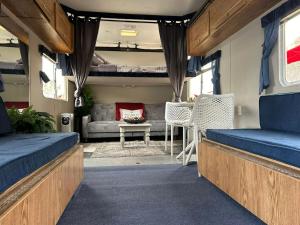 a living room with a couch and a table at Retreat (rinconcito) in Hildale