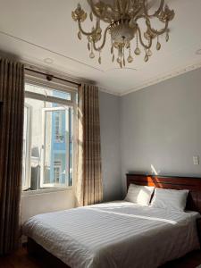 Кровать или кровати в номере Hotel Đăng Uyên D65