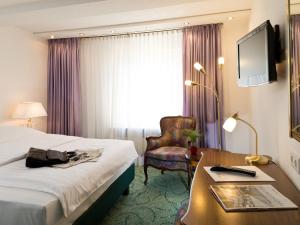 TV a/nebo společenská místnost v ubytování Hotel Palmenhof