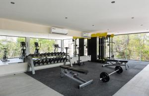 a gym with a lot of exercise equipment in it at JADE ZEN RESIDENCES - (35) in Tulum