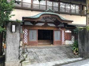 a building with two doors and a balcony at Izuya Ryokan - Vacation STAY 87162v in Miyakami