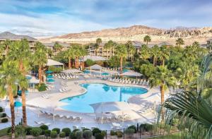 an aerial view of a resort with a pool and palm trees at Worldmark Indio in Indio