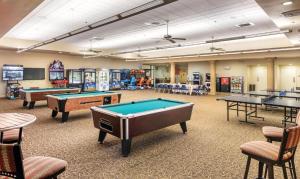 a recreation room with pool tables and other games at Worldmark Indio in Indio