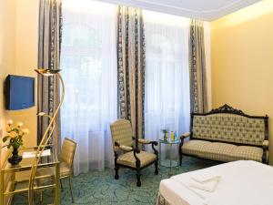 Postel nebo postele na pokoji v ubytování Hotel Palmenhof