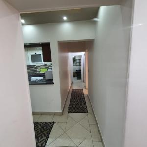 a hallway leading to a kitchen in a house at Luxury furnished apartment للعائلات فقط overlooking the sea in Alexandria +11 photos