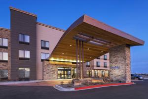 a building with awning in a parking lot at Fairfield Inn & Suites by Marriott Colorado Springs East in Colorado Springs