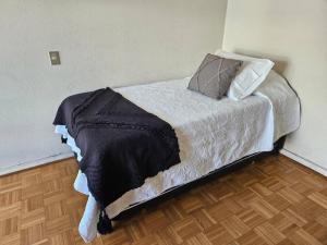 En eller flere senge i et værelse på Mejor ubicación de Viña del Mar