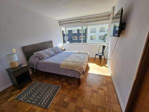 En eller flere senge i et værelse på Mejor ubicación de Viña del Mar