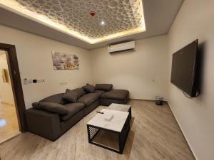 TV a/nebo společenská místnost v ubytování فندق كنف الشرائع - kanaf hotel Ash Sharāʼi + 24 fotografií