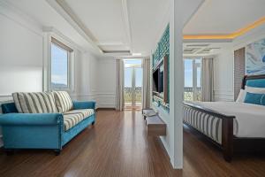 Ένα ή περισσότερα κρεβάτια σε δωμάτιο στο Paracel Beach Hotel