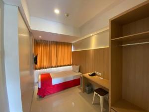 Tempat tidur dalam kamar di Hotel Brothers Inn Babarsari