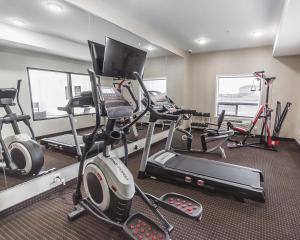 a gym with several exercise bikes and a treadmill at Comfort Inn & Suites Bonnyville in Bonnyville