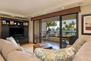 a living room with a couch and a television at Kaanapali Alii 456 in Kaanapali