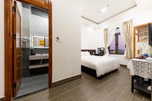 Postel nebo postele na pokoji v ubytování Olagi Hotel 2