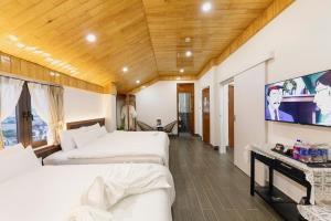 TV a/nebo společenská místnost v ubytování Olagi Hotel 2