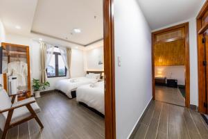 Postel nebo postele na pokoji v ubytování Olagi Hotel 2