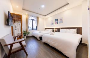 Postel nebo postele na pokoji v ubytování Olagi Hotel 2