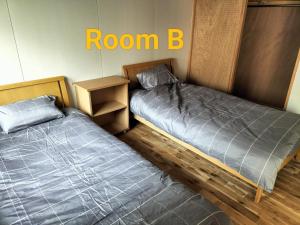 Cama o camas de una habitación en Long Stay Takayama