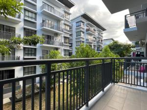 an apartment balcony with a black railing at AARON MARUDU HOMESTAY in Kampong Sorosob