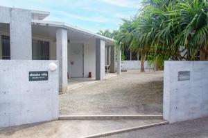 a building with a sign on the side of it at Shiraho Villa - Vacation STAY 13688v in Ishigaki Island