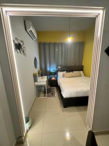 a bedroom with a bed and a window in it at شقة سليب تايم in Al Ain