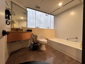 Ein Badezimmer in der Unterkunft Yixuan Yasi Apartment-free shuttle during the Canton Fari