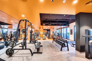 a gym with several treadmills and tread machines at Splendid brand new apartment near the beach in Dubai