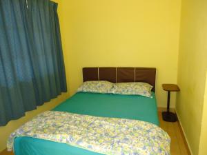 Postel nebo postele na pokoji v ubytování D'pinggir Guest Room