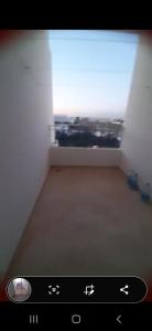 a screen shot of a room with a view of a bedroom at simple et standing in Hammamet