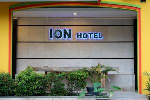 a sign for a lion hotel on the side of a building at ion hotel in Batam Center