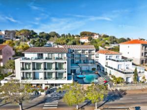 an aerial view of a building with a swimming pool at Hotel Revellata & Spa in Calvi