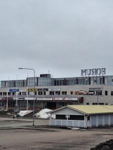 a building with a kruitt sign on top of it at Kauppakatu 57 - 8 in Varkaus