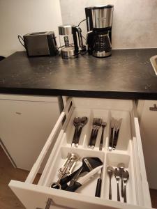 a drawer in a kitchen with utensils in it at Kauppakatu 57 - 8 in Varkaus
