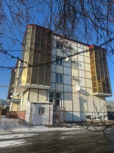 a building that is under construction in the snow at Семейная с детьми Центр in Oral