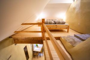 an attic room with two bunk beds and a staircase at Villa Hortensia in Tallinn