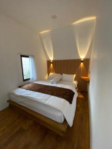 Tempat tidur dalam kamar di Zaa Villa