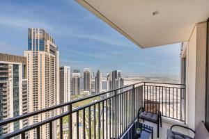 a balcony with a view of a city at Pleasant new apartment in Dubai Creek Harbour in Dubai