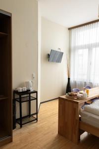 TV a/nebo společenská místnost v ubytování Pension a und a