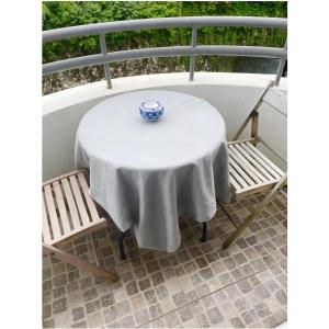 a table with a white table cloth on a balcony at Appartement Cosy- Emplacement Idéal pour les JO ! in Vanves