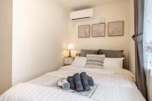 Ein Bett oder Betten in einem Zimmer der Unterkunft Felice Nishi-Shinjuku
