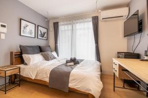 Ein Bett oder Betten in einem Zimmer der Unterkunft Felice Nishi-Shinjuku