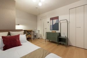 Ein Bett oder Betten in einem Zimmer der Unterkunft Felice Nishi-Shinjuku