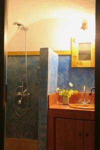 a bathroom with a shower and a sink at Axion Studios in Aroniadika