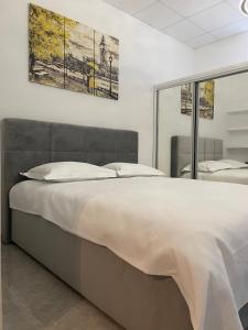 a bedroom with a large bed in a room at TLux in Stolac